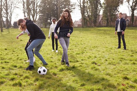 group of friends playing soccer